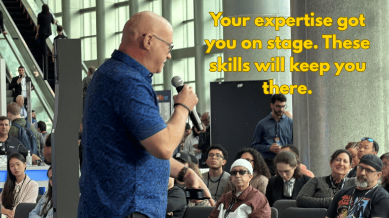 Phil Mershon speaking on stage coaching presenters on delivery and presentation skills