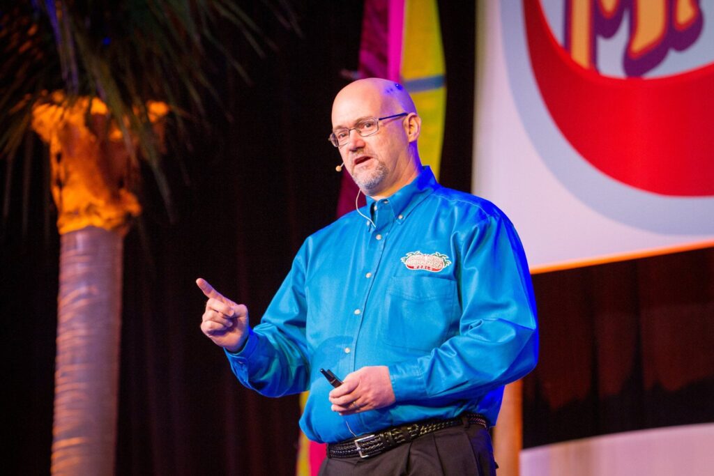 Phil Mershon speaking on stage — how to make a presentation memorable
